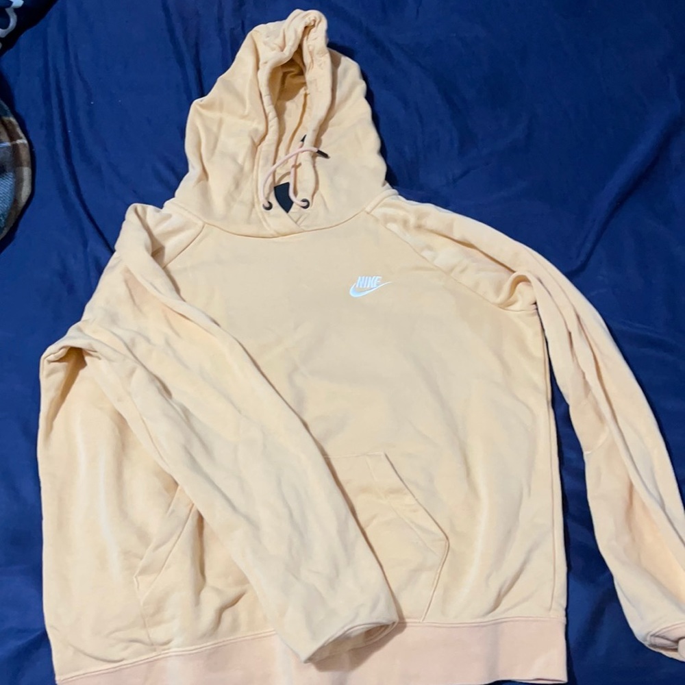 Nike hoodie. creamy orange color. super cute!